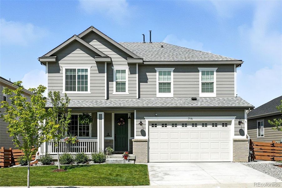 Front exterior of a new home in Colliers Hill, Erie, CO, highlighting curb appeal (Image 2). Front exterior of a new home in Colliers Hill, Erie, CO, highlighting curb appeal (Image 2).