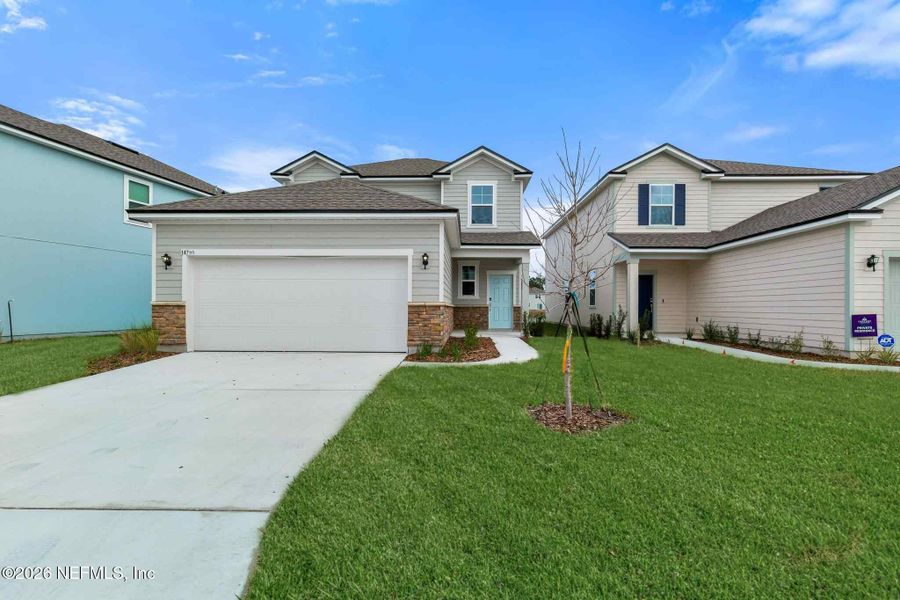 Front exterior of a new home in , Jacksonville, FL, highlighting curb appeal (Image 19).
