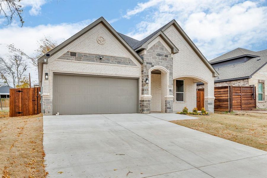 View of front of property with a garage