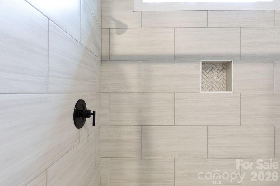 Tiled shower with cubby. Tiled shower with cubby.
