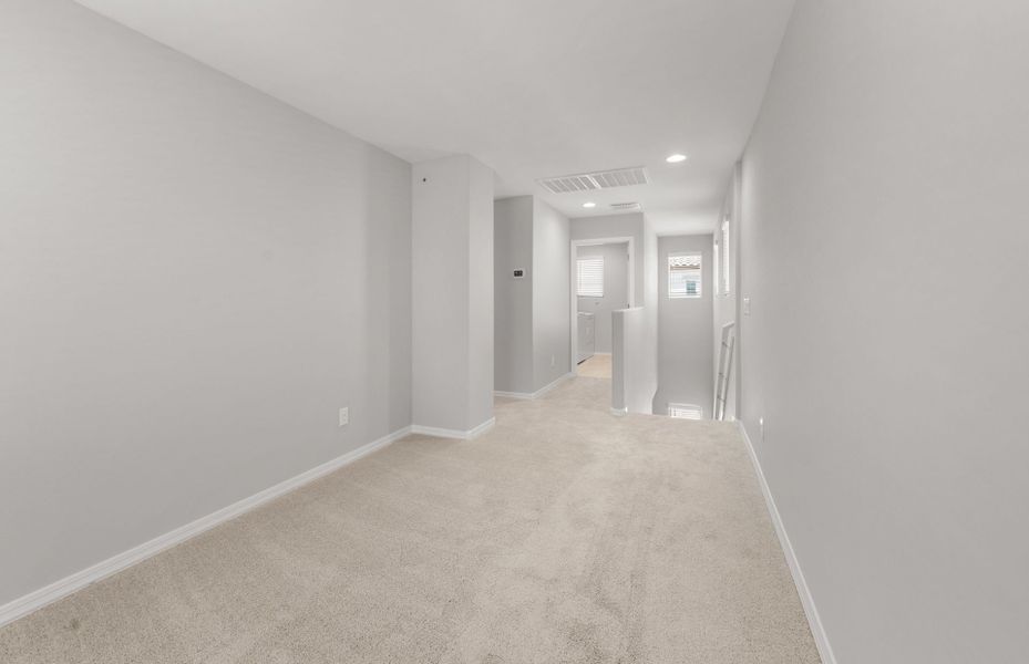Spacious, unfurnished interior of a new home in Asante- Atrium Series, Surprise (Image 18).