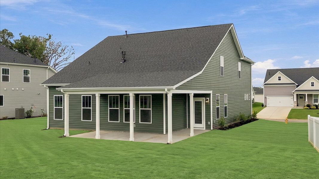 Established charm meets functional outdoor living with a spacious rear covered porch at Woodglen