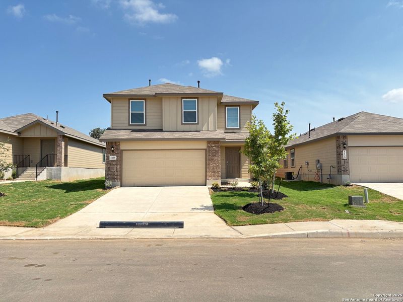 Front exterior of a new home in Langdon, San Antonio, TX, highlighting curb appeal (Image 29). Front exterior of a new home in Langdon, San Antonio, TX, highlighting curb appeal (Image 29).