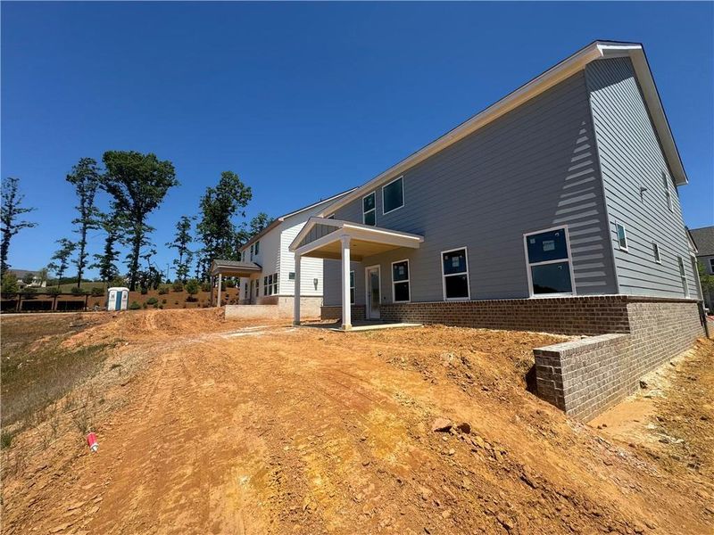 Exterior details and patio area of a home in Eastlyn Crossing, Flowery Branch (Image 4).