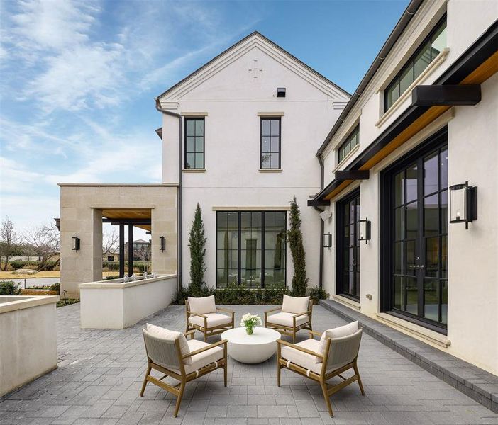 Front courtyard off of the great room with water feature and view of lake
