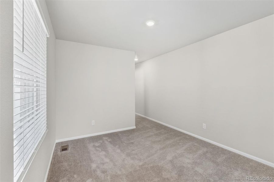 Spacious, unfurnished interior of a new home in Woodrose at Painted Prairie, Aurora (Image 20).