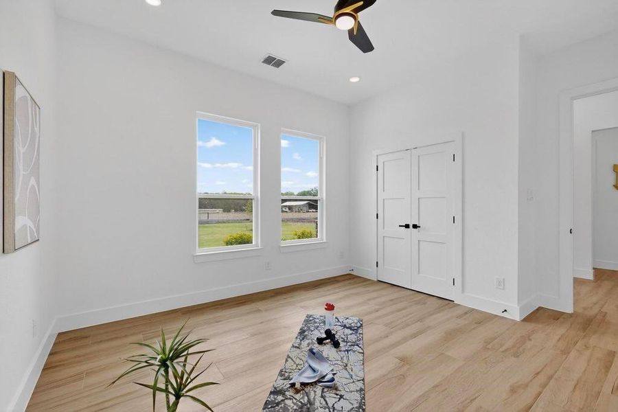 Unfurnished bedroom featuring recessed lighting, a ceiling fan, light wood finished floors, and a closet Unfurnished bedroom featuring recessed lighting, a ceiling fan, light wood finished floors, and a closet