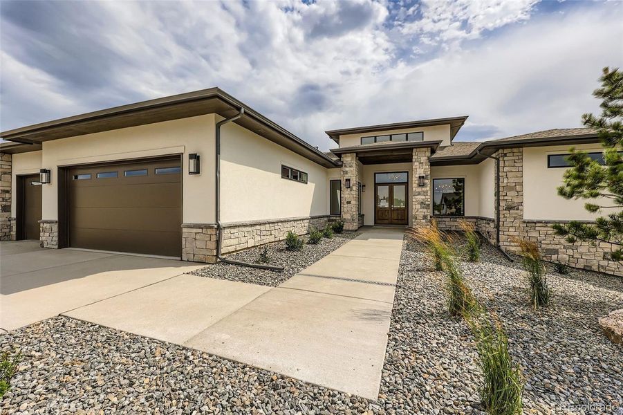 Front exterior of a new home in , Parker, CO, highlighting curb appeal (Image 27).