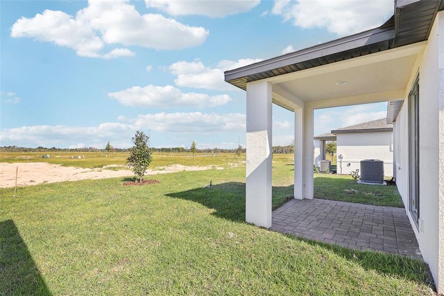 Exterior details and patio area of a home in Springs at Lake Alfred - Classic Series, Lake Alfred (Image 4).