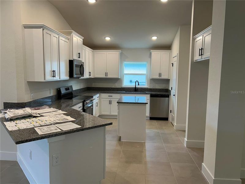 Furnished interior view inside a new home in Watercress Cove, North Port (Image 8).