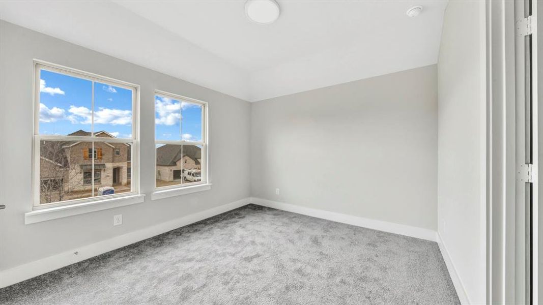 Unfurnished room with carpet floors