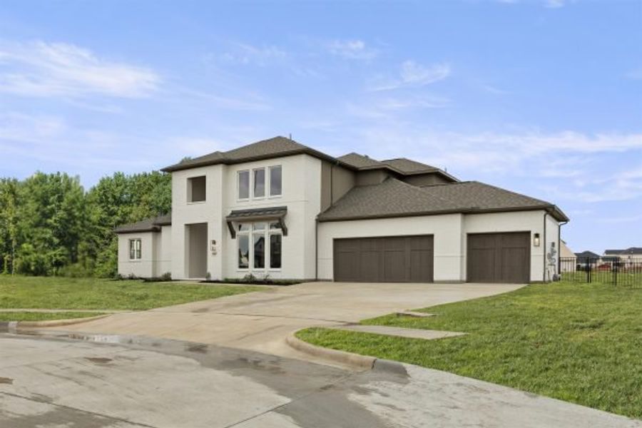 Representative exterior photo of a completed home built from the Tahiti by Stonefield Homes in Heath Golf and Yacht Club, Rockwall, TX (Image 33).