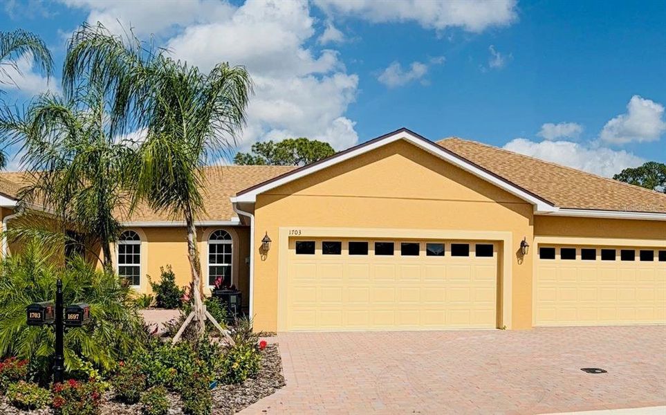 Front exterior of a new home in , Winter Haven, FL, highlighting curb appeal (Image 17).