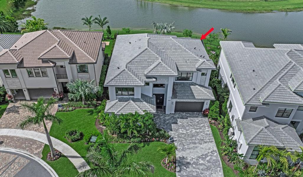 Front exterior of a new home in Apex at Avenir, Palm Beach Gardens, FL, highlighting curb appeal (Image 25).