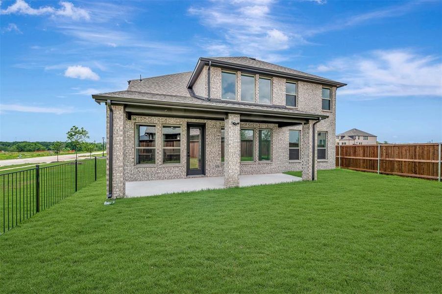 Exterior details and patio area of a home in Lily Creek at Sutton Fields, Aubrey (Image 3). Exterior details and patio area of a home in Lily Creek at Sutton Fields, Aubrey (Image 3).