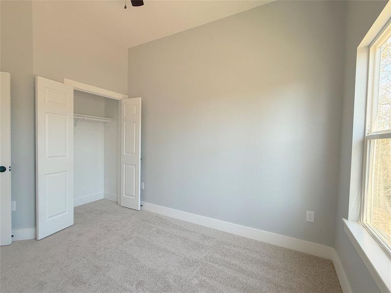 This is the third bedroom full of Natural Light. It is spacious and has ample closet space.