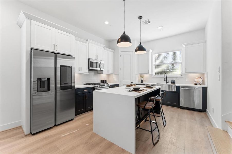 Welcome HomeKitchen Area - Second Floor - Photos are from the same builder but a different project. Homes may be different