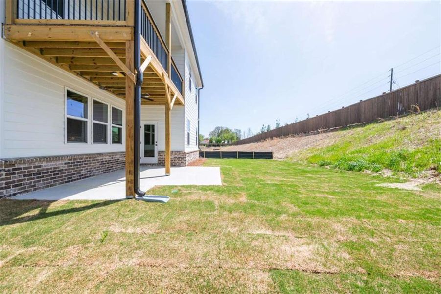 Exterior details and patio area of a home in The Paddocks at Doc Hughes, Buford (Image 1).