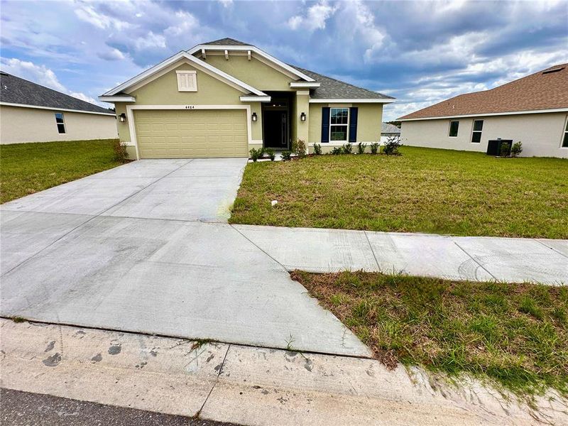 Front exterior of a new home in , Ocala, FL, highlighting curb appeal (Image 13). Front exterior of a new home in , Ocala, FL, highlighting curb appeal (Image 13).