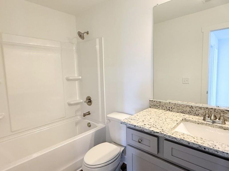 Furnished interior view inside a new home in Sutton's Landing, Statham (Image 8).