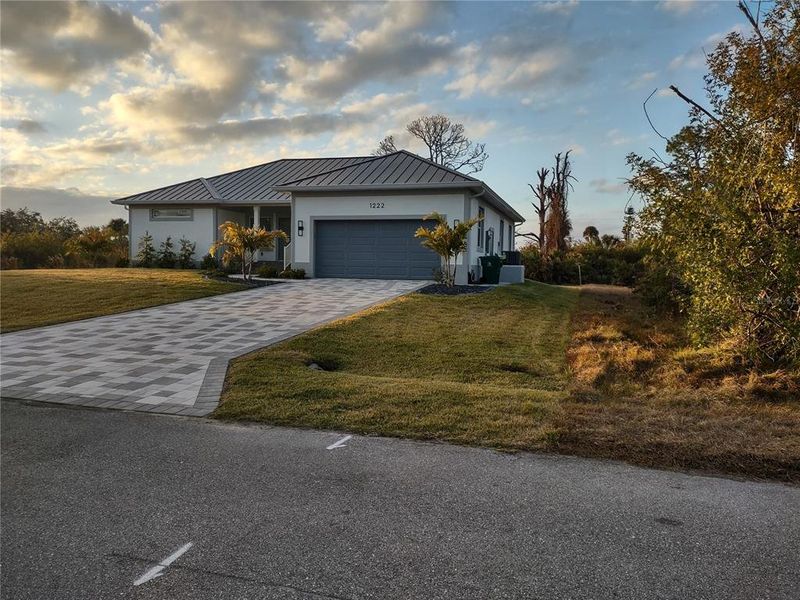 Front exterior of a new home in , Port Charlotte, FL, highlighting curb appeal (Image 1). Front exterior of a new home in , Port Charlotte, FL, highlighting curb appeal (Image 1).