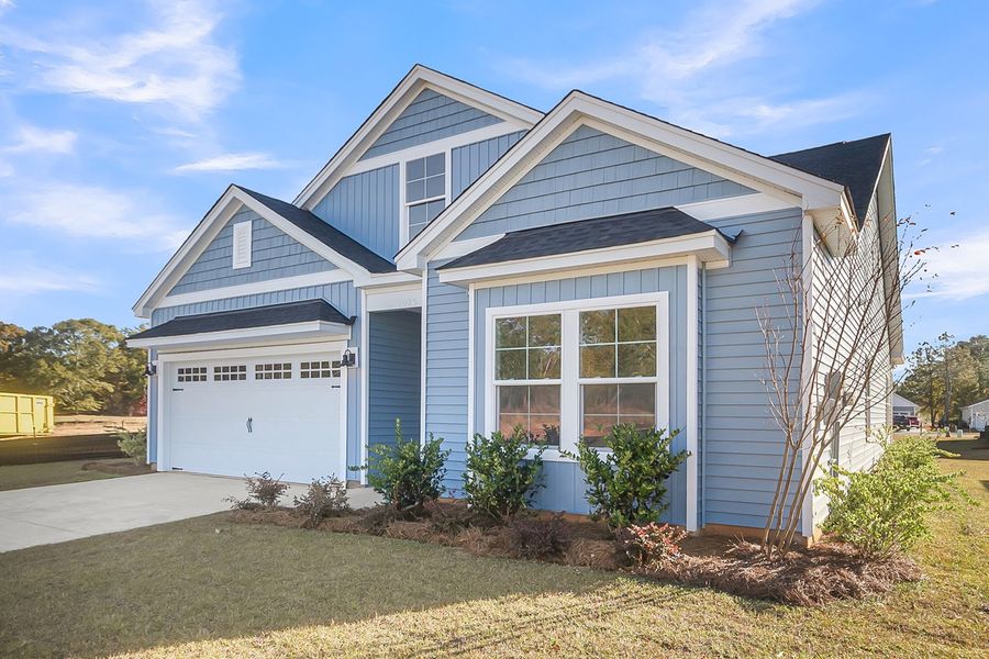Front exterior of a new home in Fairway Woods at Wyboo, Manning, SC, highlighting curb appeal (Image 2).