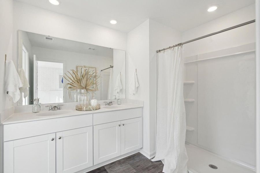 Furnished interior view inside a new home in Lindera Preserve at Cane Bay Plantation: Townhomes, Summerville (Image 7). Furnished interior view inside a new home in Lindera Preserve at Cane Bay Plantation: Townhomes, Summerville (Image 7).