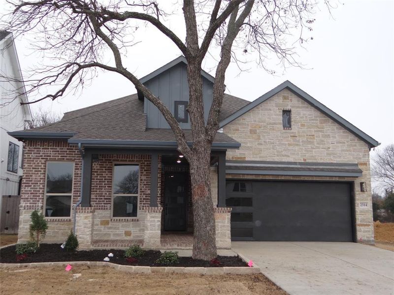 View of front of property with a 2-car garage