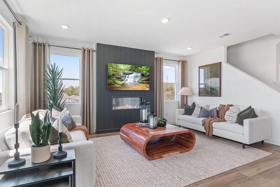 A living room with a fireplace.