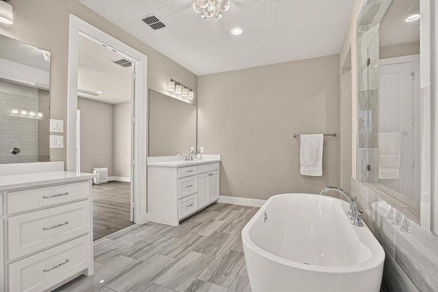 Freestanding soaking tub with floor-mounted faucet Freestanding soaking tub with floor-mounted faucet