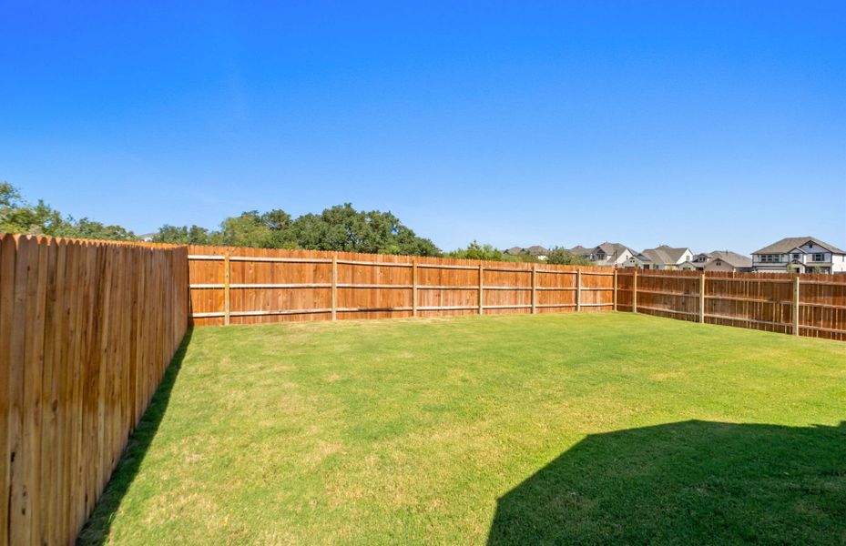 Exterior details and patio area of a home in Saddleback at Santa Rita Ranch, Liberty Hill (Image 22). Exterior details and patio area of a home in Saddleback at Santa Rita Ranch, Liberty Hill (Image 22).