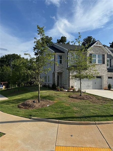 Front exterior of a new home in , Mableton, GA, highlighting curb appeal (Image 18).
