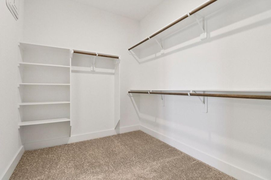 Primary Walk-In Closet Primary Walk-In Closet