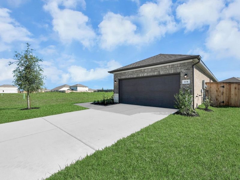 Front exterior of a new home in Emberly, Beasley, TX, highlighting curb appeal (Image 23). Front exterior of a new home in Emberly, Beasley, TX, highlighting curb appeal (Image 23).