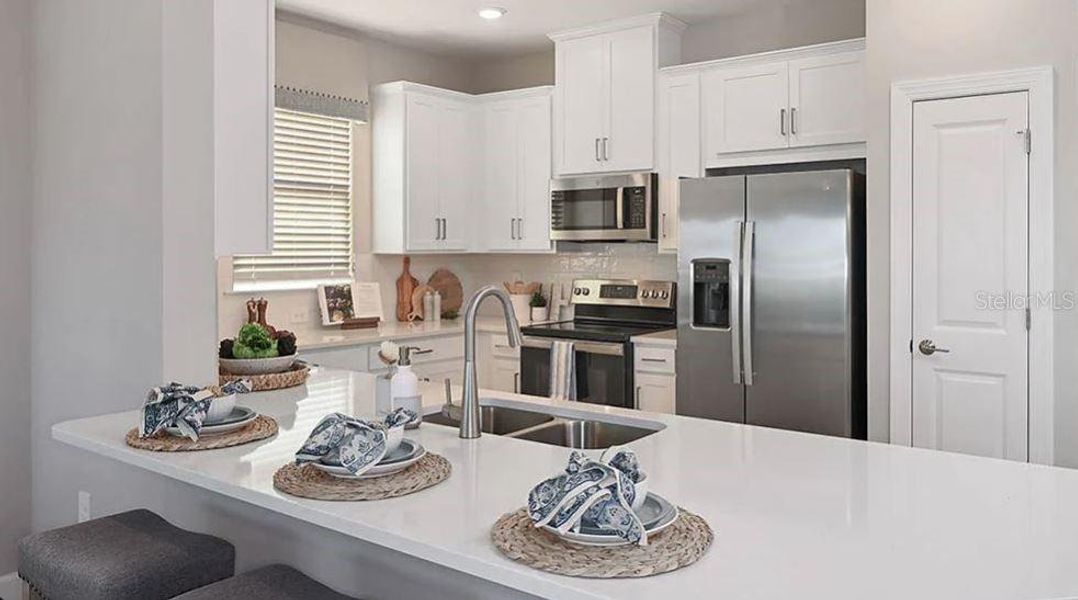Furnished interior view inside a new home in The Cove at West Port, Port Charlotte (Image 4). Furnished interior view inside a new home in The Cove at West Port, Port Charlotte (Image 4).