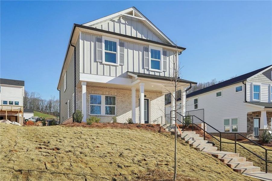 Exterior details and patio area of a home in Hemingway - Cottage Series, Cumming (Image 20).