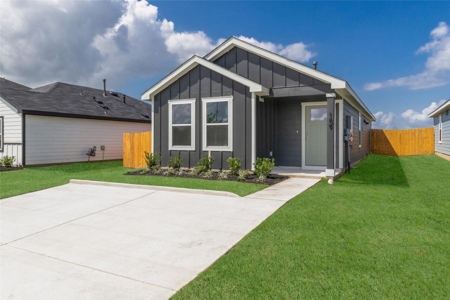 Front exterior of a new home in Marigold, Uhland, TX, highlighting curb appeal (Image 1). Front exterior of a new home in Marigold, Uhland, TX, highlighting curb appeal (Image 1).