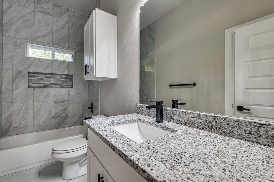 Bathroom with vanity and shower / washtub combination Bathroom with vanity and shower / washtub combination