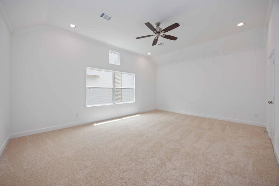 With soaring ceilings, soft carpet underfoot, and abundant wall space, the primary bedroom gives you endless options to create your dream retreat.