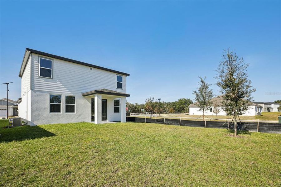 Exterior details and patio area of a home in The Reserve at Hammock Oaks - Classic Series, Lady Lake (Image 28).