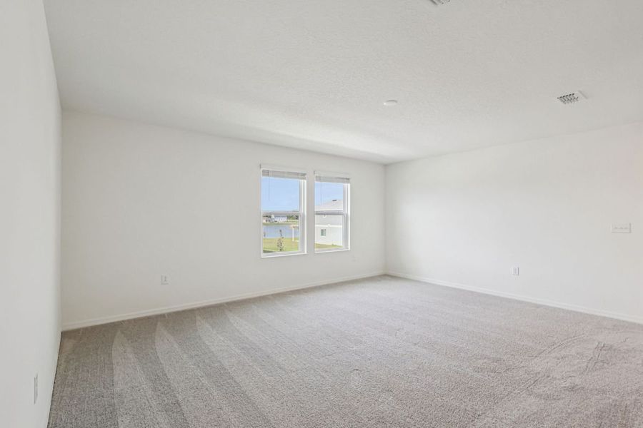 Spacious, unfurnished interior of a new home in Gardens at Waterstone II, Palm Bay (Image 7).