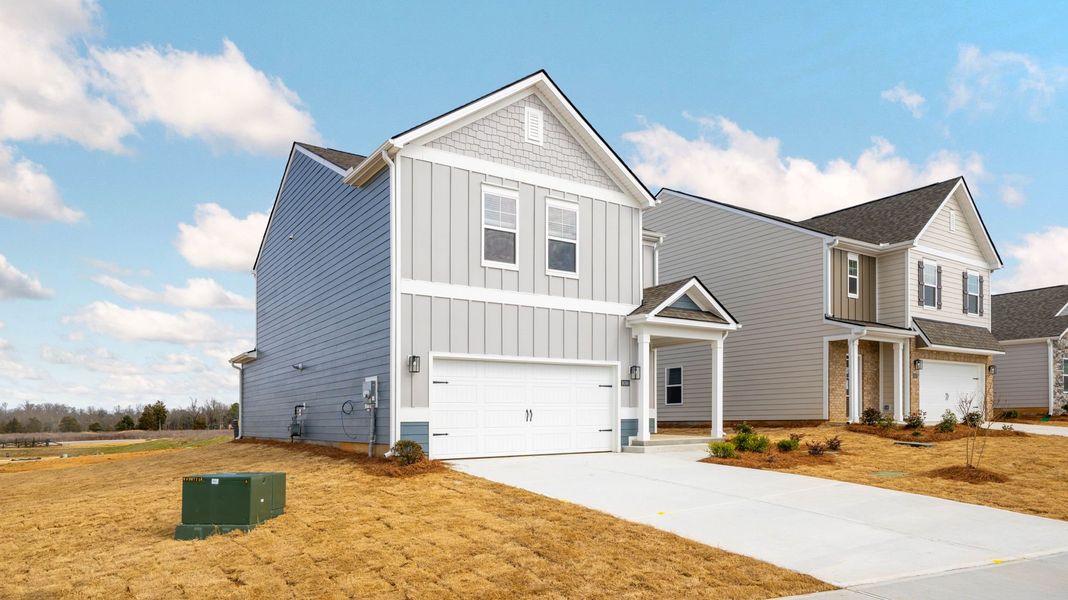 Front exterior of a new home in Harbor Crest, Ooltewah, TN, highlighting curb appeal (Image 2).
