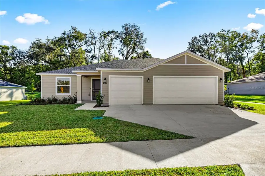 Front exterior of a new home in Marion Ranch, Ocala, FL, highlighting curb appeal (Image 2).