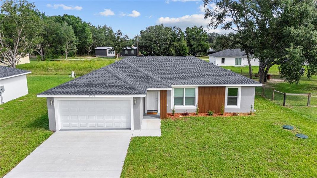 Front exterior of a new home in , Dunnellon, FL, highlighting curb appeal (Image 15). Front exterior of a new home in , Dunnellon, FL, highlighting curb appeal (Image 15).