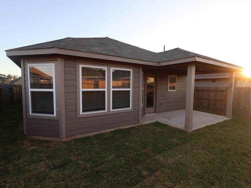 Exterior details and patio area of a home in Pinewood at Grand Texas, New Caney (Image 2).