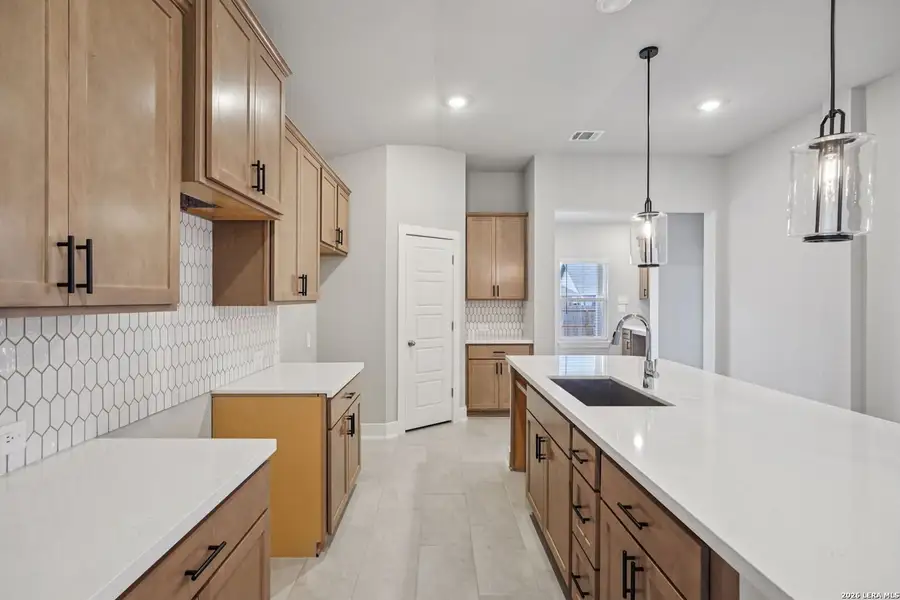 Furnished interior view inside a new home in Estancia Ranch - Premier Series, San Antonio (Image 11).