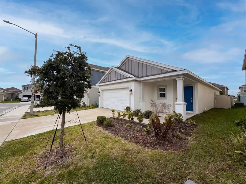 Front exterior of a new home in Cascades, Davenport, FL, highlighting curb appeal (Image 1). Front exterior of a new home in Cascades, Davenport, FL, highlighting curb appeal (Image 1).