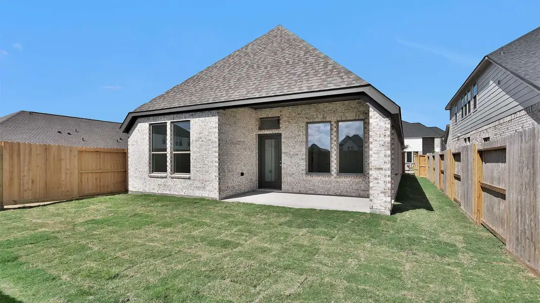 Exterior details and patio area of a home in Candela South 40', Richmond (Image 3).