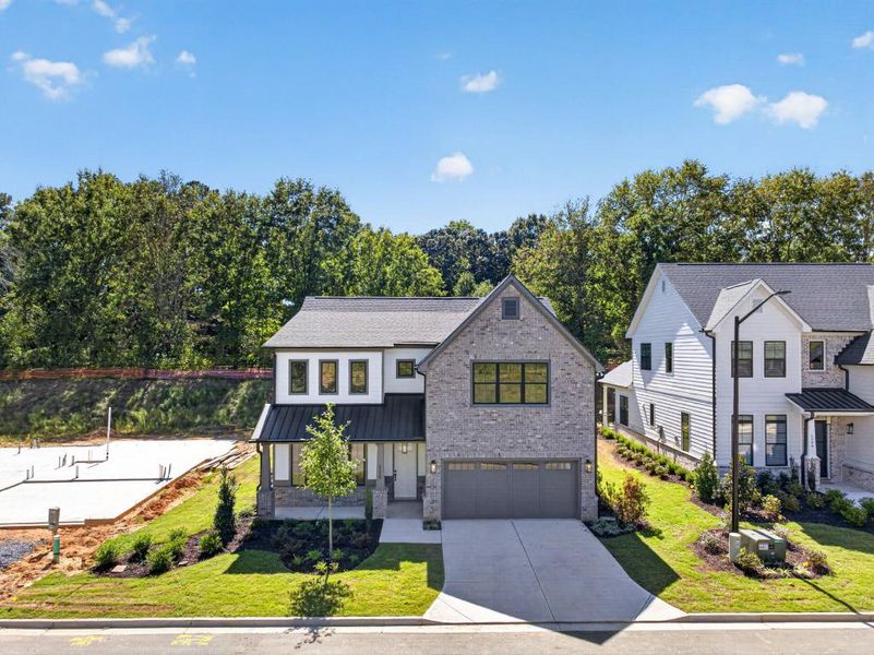 Front exterior of a new home in Livingstone Park, Kennesaw, GA, highlighting curb appeal (Image 31).