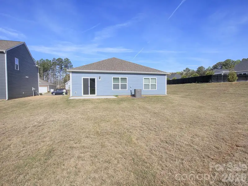 Exterior details and patio area of a home in Villas at Sherrills Ford, Terrell (Image 3).